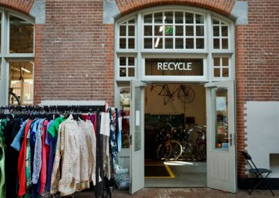 Recycle center with clothes and bicycles inside